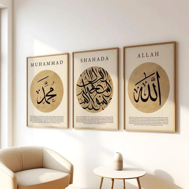 Three framed Islamic calligraphy posters on a wall with a beige sofa and small table in the foreground.