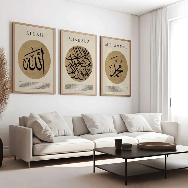 Living room with white sofa and three framed Islamic calligraphy posters on the wall.