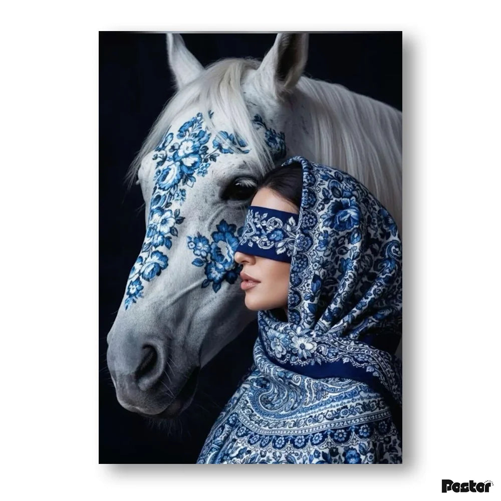 Woman in a blue patterned hijab standing next to a white horse with blue floral designs.