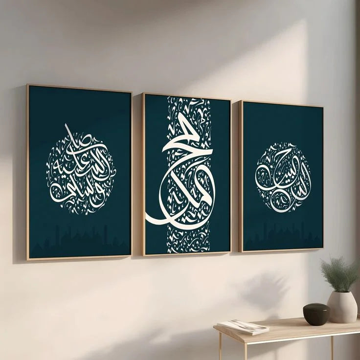 Three framed pieces of art with white calligraphy on a dark blue background, displayed on a wall.