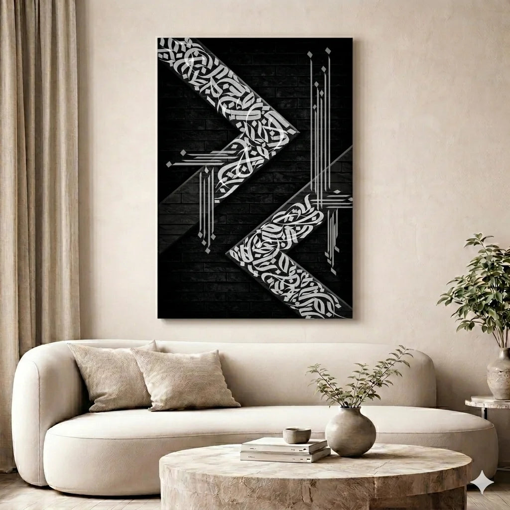 Abstract black and white artwork on a wall above a beige sofa in a living room.