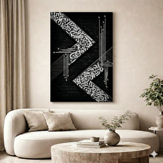 Abstract black and white artwork on a wall above a beige sofa in a living room.