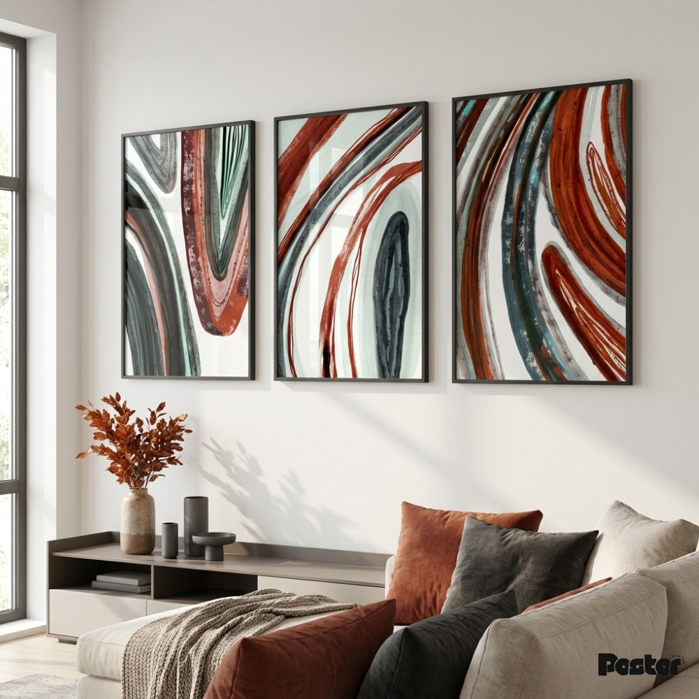 Three abstract wall art pieces in a living room setting.